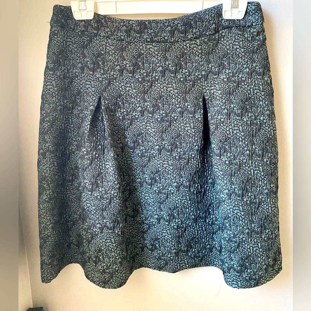 Skirt in a blue green matelasse print .Very flattering.